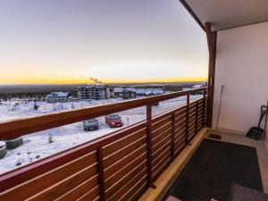 a balcony with a view of a parking lot at Holiday Home Ylläs chalets a202 by Interhome in Ylläs +9 photos
