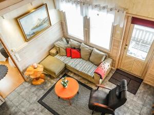 an overhead view of a living room with a couch and a table at Holiday Home Lustola a by Interhome in Luosto