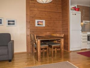 a kitchen and dining room with a table and chairs at Holiday Home Ylläs chalets a402 by Interhome in Ylläs