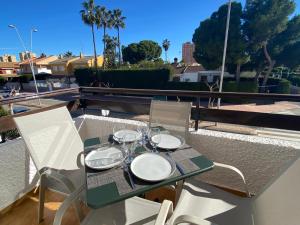 a table with glasses on it on a balcony at Apartment with private balcony in San Javier