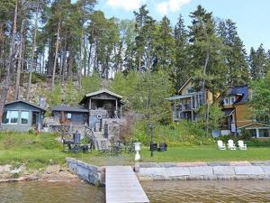a house on the shore of a body of water at Holiday Home Lövkulla by Interhome in Löparö