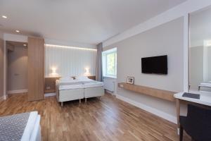 TV i/ili multimedijalni sistem u objektu Rannahotell