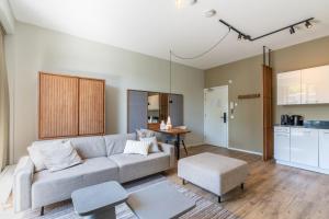 a living room with a couch and a table at Utrecht City Apartments - Huizingalaan in Utrecht