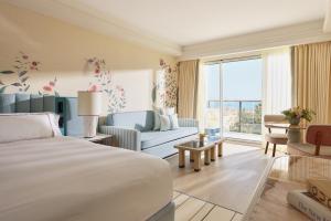 a bedroom with a bed and a living room at Don Carlos Marbella in Marbella +133 photos