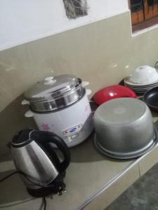 a kitchen counter with pots and pans on a counter top at Nadi Villa Midigama in Midigama East +26 photos