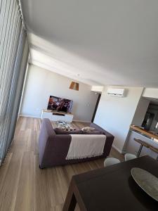 a living room with a large bed in a room at Semipisos Balcarce in Balcarce
