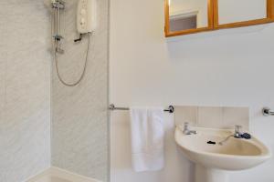 a bathroom with a sink and a shower at 1 Bed in St. Ives oc-pc716a in St Ives