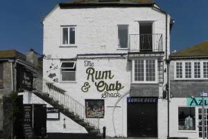 a white building with the run and ends sign on it at 1 Bed in St. Ives oc-pc716a in St Ives +3 photos