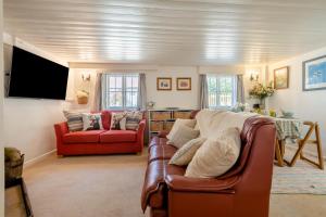 a living room with a couch and a tv at 2 Bed in Landford oc-l31877 in Landford