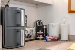 a refrigerator sitting on top of a kitchen counter at 2 Bed in Landford oc-l31877 in Landford