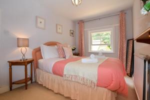 a bedroom with a bed and a window at 2 Bed in Landford oc-l31877 in Landford +21 photos