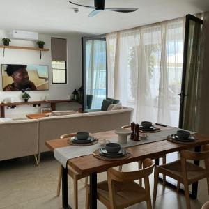 a living room with a table and a couch at Lulu Diani in Diani Beach