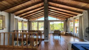 a living room with a wooden ceiling and windows at Montezuma Hills - Twin Houses in private compound - 4' to Downtown in Montezuma