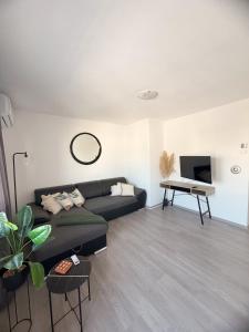 a living room with a couch and a table at Bajkoviti kutak in Ogulin