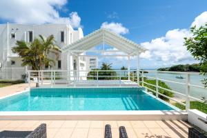 a villa with a swimming pool and the ocean at Anniversario in Onna