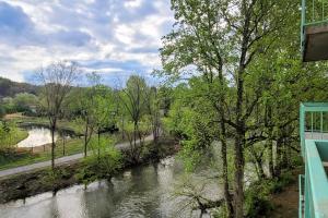 a view of a river from a building at Delightful Condo Sleeps 6 Shared Pool Picnic Area in Pigeon Forge