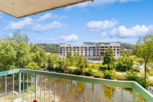 a view from the balcony of a building at Delightful Condo Sleeps 6 Shared Pool Picnic Area in Pigeon Forge +16 photos