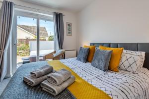 a bedroom with a bed with towels on it at 3 Bed in Braunton oc-b29581 in Braunton