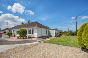 a white house with a driveway at 3 Bed in Braunton oc-b29581 in Braunton