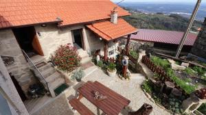 an aerial view of a house with a red roof at O Palheiro in Caramulo