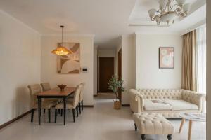 a living room with a couch and a table at SG lusxury city in Ho Chi Minh City