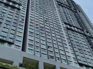 a tall building with a lot of windows at ImpianKU MetaStay KL in Seri Kembangan