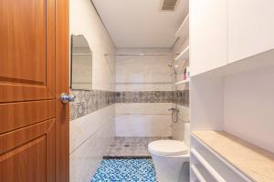 a bathroom with a toilet and a shower at SG lusxury city in Ho Chi Minh City +94 photos