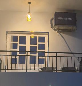 a room with a balcony with a window and a heater at Happiness Guest House in Luxor