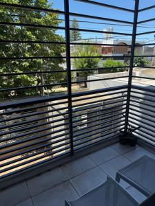 a view of a balcony with a view of a train at Iluminado y céntrico in San Nicolás de los Arroyos