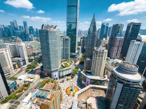 an aerial view of a city with tall buildings at Chongqing IBESHO HOTEL in Chongqing +24 photos