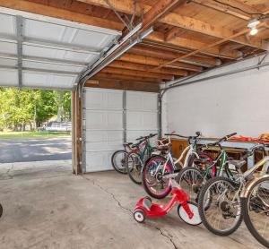 a group of bikes parked in a garage at Pet-friendly Cabin with Dock, Firepit, BBQ in Newaygo