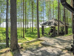 a gazebo in the middle of a forest at Holiday Home Tavintupa by Interhome in Pertunmaa
