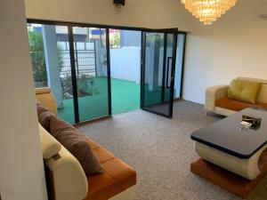 a living room with a couch and a table at Danzha Royal 4 in Erbil