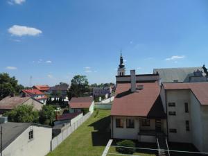 a view of a town from the roof of a building at Nocleg u Mario in Uniejow