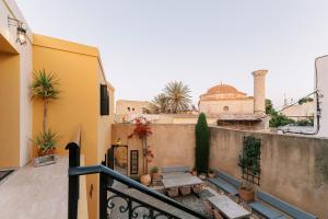a balcony with a view of a building at Zacosta Villa - a Heritage Hotel in Rhodes Town