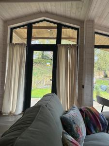 a living room with a couch in front of a window at Ferienhaus Barth in Waldbröl in Waldbröl