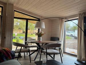 a dining room with a table and chairs and a window at Ferienhaus Barth in Waldbröl in Waldbröl