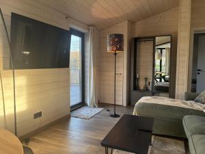 a bedroom with a large flat screen tv on the wall at Ferienhaus Barth in Waldbröl in Waldbröl