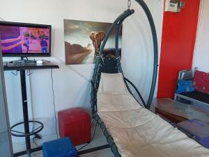 a room with a fire hose hanging on a wall at BEN & LEK GUESTHOUSE in Pattaya South