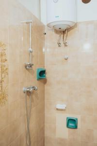 a bathroom with a shower with a shower head at Tonnara Vista Mare in Palmi
