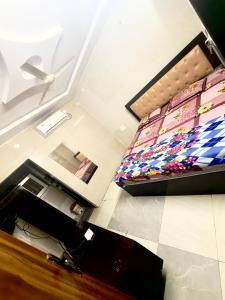 a view of a bedroom with a bed in a room at Santhosh hotel in Khammam