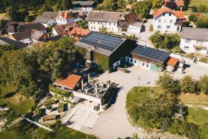 an aerial view of a house with solar panels on it at Bauer & Wirt Langthaler in Emmersdorf an der Donau +34 photos