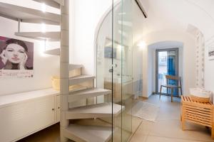 a glass staircase in a bathroom with a mirror at Dimora Delle Stelle - Design & Heritage in Bari
