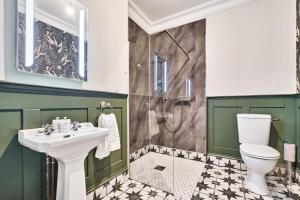 a bathroom with a sink and a toilet at The Lawrence in Derry Londonderry