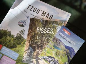 a magazine with the words you may bless la crate at Chalet Chalet Chante Neige by Interhome in Riddes +35 photos