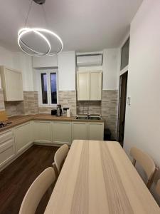 a kitchen with a large wooden table and chairs at Casa Giovanni in Turin