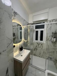 a bathroom with a sink and a shower at Casa Giovanni in Turin +9 photos
