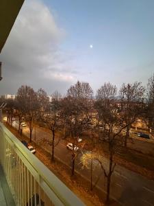 a view of a city from a balcony with trees at Casa Giovanni in Turin