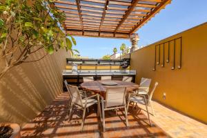 a patio with a table and chairs on it at Designer Retreat in Centro Heated Pool & Views in San Miguel de Allende