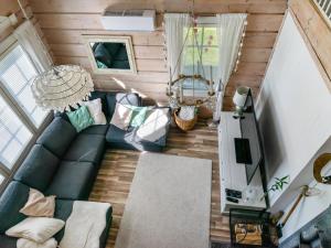 an overhead view of a living room with a blue couch at Holiday Home Tuliniemi by Interhome in Iisalmi
